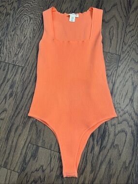 Orange Ribbed One-Piece Bodysuit +